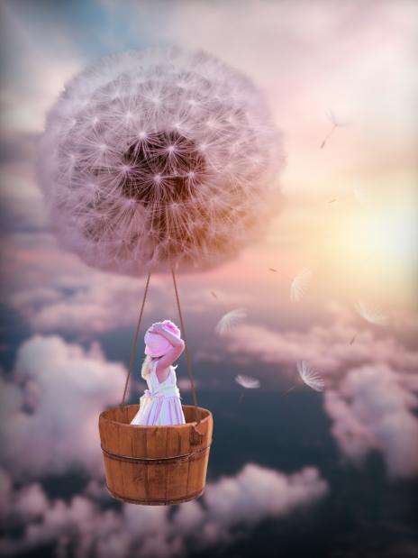 Digital edit of girl in dandelion hot air balloon